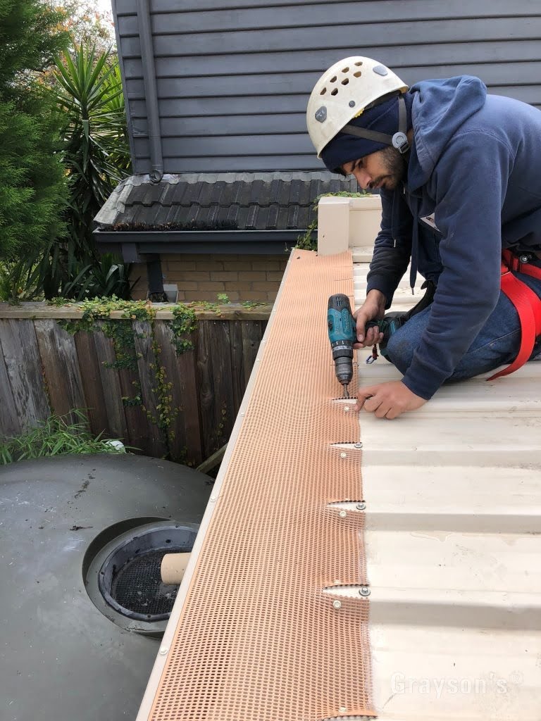 Gutter Guard Mesh Bolted down to Trim Deck roofs