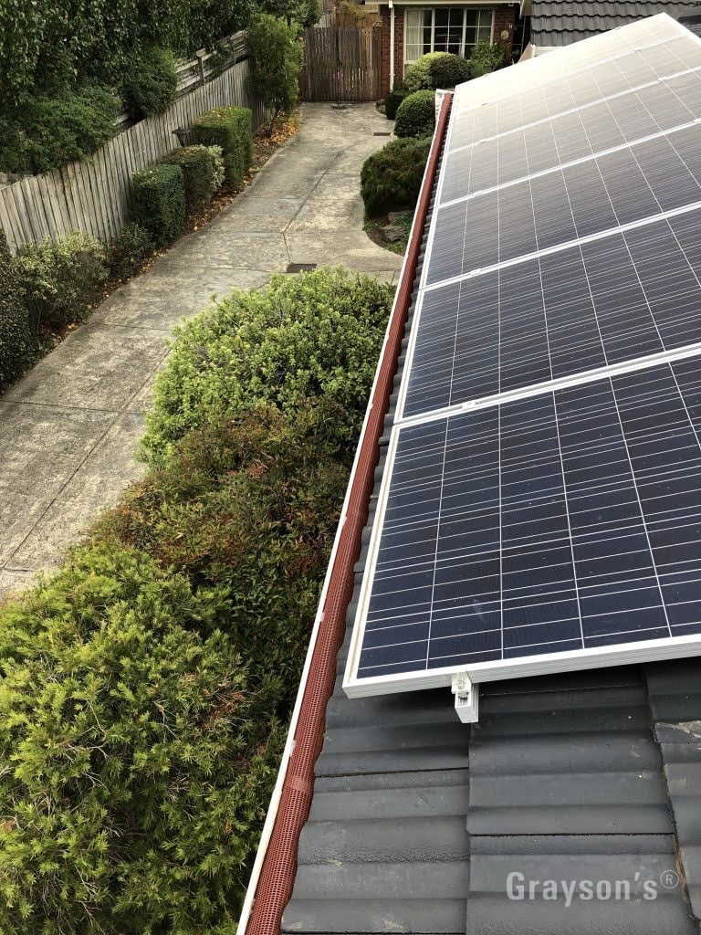 A perfect example of a suitable application for the Triple-G gutter guard system. With the solar panels overlapping the bottom tiles it can be too difficult to install other types of gutter guard.