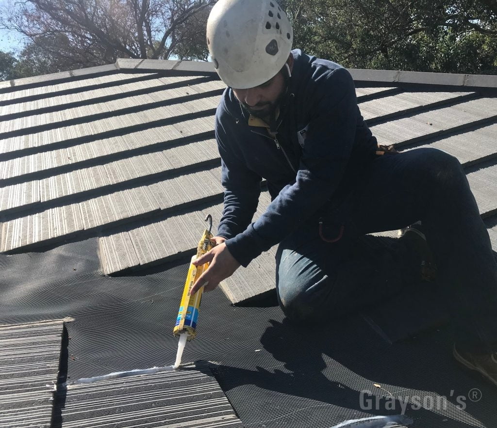Repairing a gutter guard system that's fitted to completely cover a valley. We recommend against this type of install, but we are happy to service existing valley mesh.