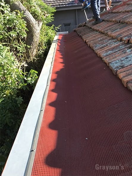 Gutter Guard protecting a tiled roof with box gutters