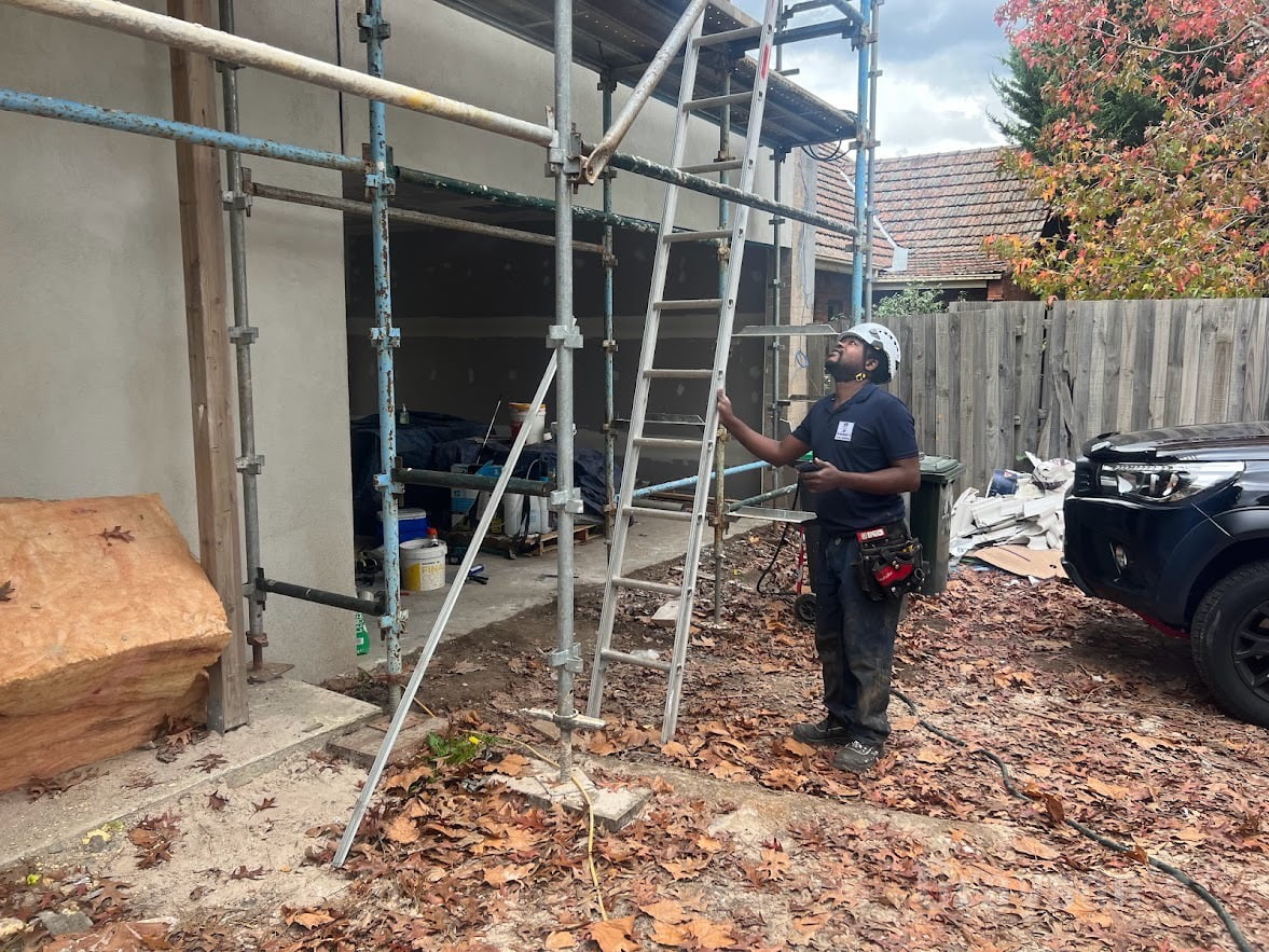 Gutter Guard Fitter inspecting the Builders Ladder