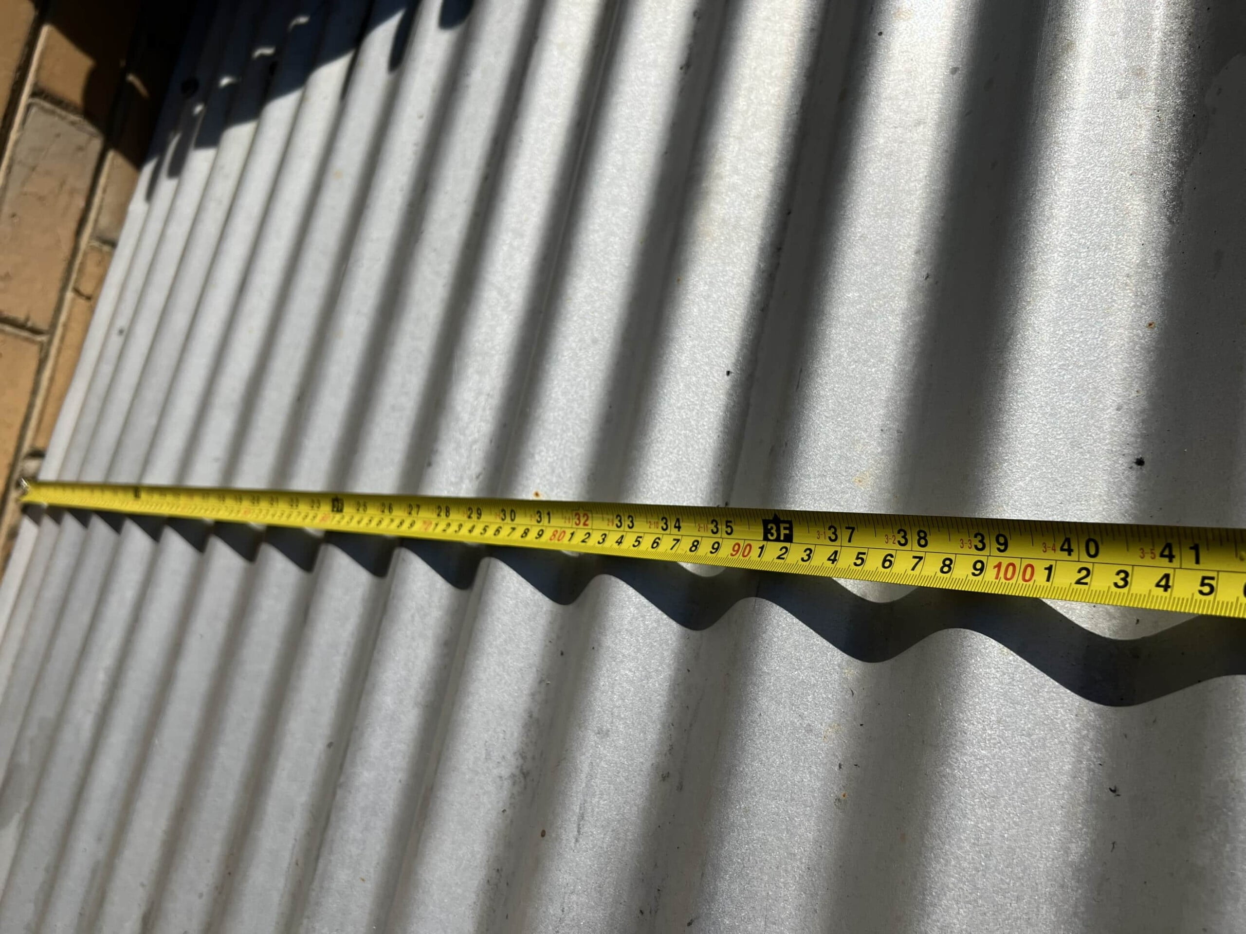 Measuring a corrugated roof for gutter guard