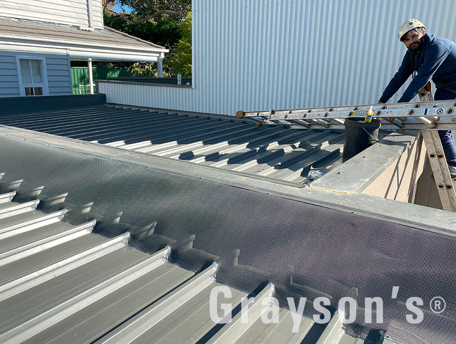 Box Gutter Guard installed on a flat roof