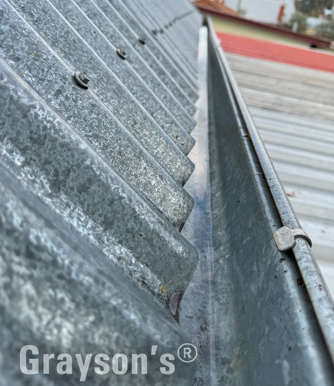 High front gutters on corrugated roof